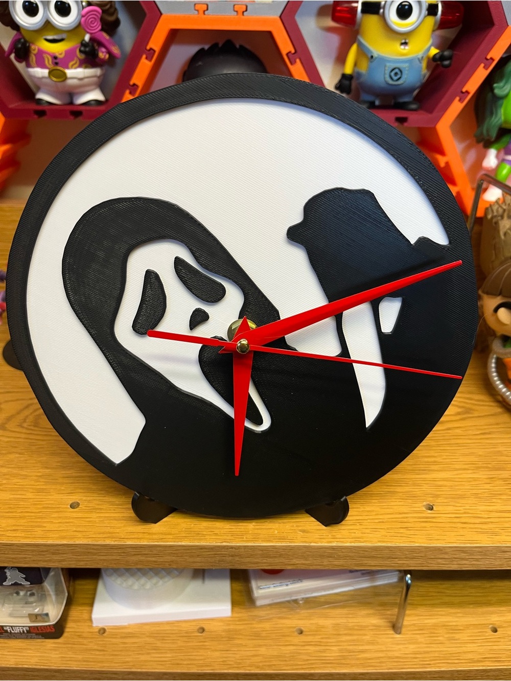 Black & White Horror Mask Wall Clock with Red Hands